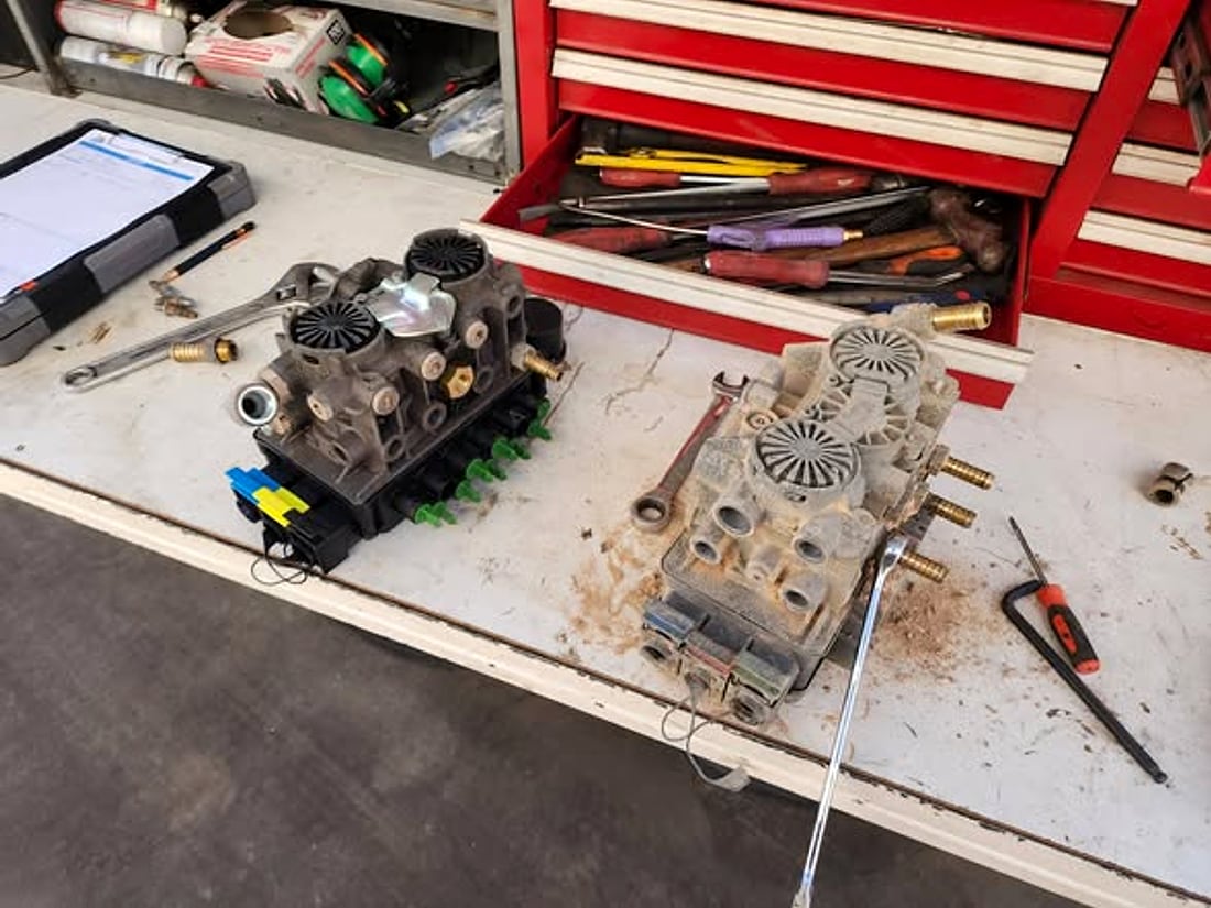 EBS modules and tools laid out on the workbench mid-job